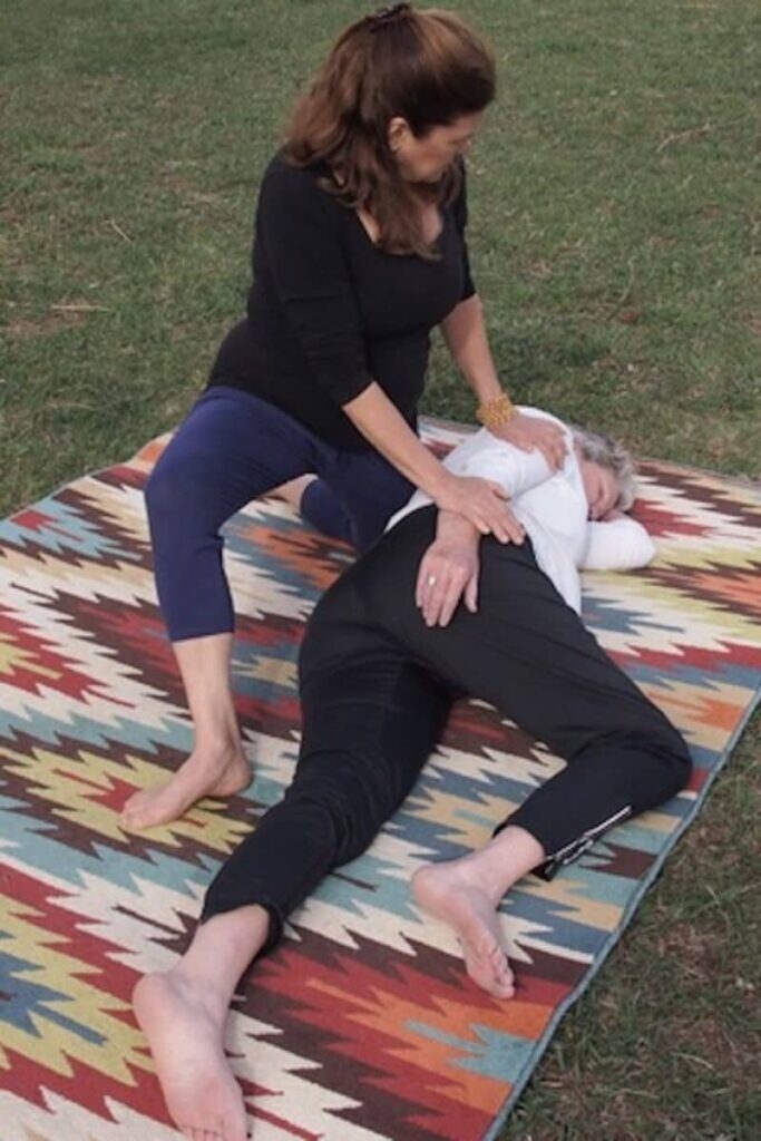 Instructor leading a Thai Massage session